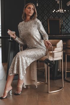 The going out dress every girl needs in her wardrobe! This chic, flowy sequin midi features two side slits and an easy fit. Feel comfy and stylish all at the same time in this perfect new midi dress. *Sequins*92% Nylon 8% Spandex | Lining: 100% Polyester*Lined*Double slit*54" shoulder to hem Model Christen is 5'9 wearing a small  SHOP THE LOOK Silver Dress Outfit, Black Tie Event Outfit, Luulla Dresses, Sequin Dress Outfit, Fancy Fits, Going Out Dress, Sequin Outfit, Amazing Lace, Sequin Maxi