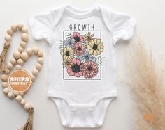 Baby Baby Bodysuit - Growth Wild Flower Bodysuit - Flower Retro Natural Baby Bodysuit All of the shirts and bodysuits at our shop are CPSIA compliant. We only use Eco-friendly, water-based inks that are also CPSIA compliant and boasts strong washability (highest score on AATCC wash test).  So rest assure to put them on your little ones!  ** COLOR OF T-SHIRTS WILL VARY SLIGHTLY DUE TO LIGHTING AND/OR MONITOR SETTINGS ** DETAILS OF BABY BODYSUITS & T-SHIRTS MAY VARY SLIGHTLY FROM PRODUCT PHOTOS BA Flower Bodysuit, Flower Retro, Tshirt Ideas, Photo B, Natural Baby, Wild Flower, Product Photos, Handmade Baby, Baby Baby