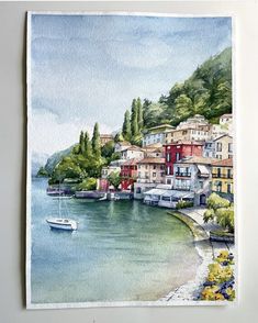 a watercolor painting of boats and houses on the shore