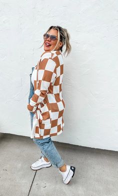 Brown and white checkered pattern thumbhole cardigan. Available in one size and plus one size. One size length 33” arm length 22.5” fits sizes 4-12 Plus one size length 34.5” arm length 23.5” fits sizes 14-22 Checkered Cardigan, Plus Size Fall, Checker Print, Patterned Cardigans, Plus Size Fits, Lounge Dress, Checkered Pattern, Apparel Design, Popcorn