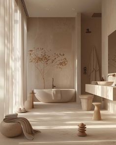 a bathroom with a large tub, sink and toilet next to a tall white window