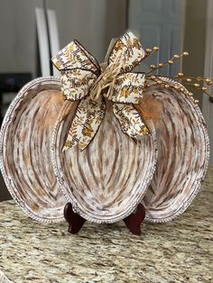 two decorative pumpkins sitting on top of a counter