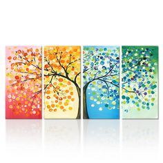 four colorful paintings with trees painted on them