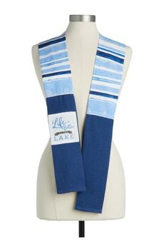 a blue and white striped scarf on a mannequin