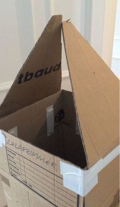 an open cardboard box sitting on the floor