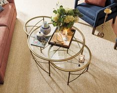 a living room filled with furniture and a coffee table