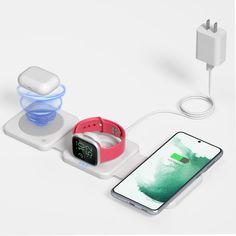 an apple watch and charging station on a white surface