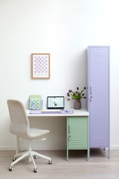 a purple locker sitting next to a white desk