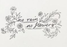 the words are written in black ink on a white paper with flowers and leaves around it