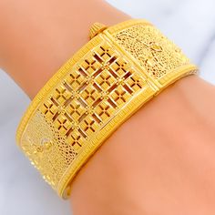 This exquisite 22k gold bangle, weighing 39.9 grams, features a bold and opulent square design that exudes elegance and sophistication. The yellow gold finish enhances its luxurious appeal, making it perfect for any special occasion. The bangle has a size of 2.8 and an opening diameter of 2.5 inches, offering both style and comfort. This piece is openable, designed with a screw and hinge for added convenience. Ideal for those who appreciate high-quality craftsmanship and timeless beauty, this bo Elegant Yellow Gold Cuff Bracelet For Festivals, Luxury Formal Bangle For Festivals, Gold Rectangular Bangle Gift, 22k Gold Bangles, Bridal Jewelry Necklace, Precious Stones Rings, Statement Rings Diamond, Diamond Pendant Sets, Modern Bracelets