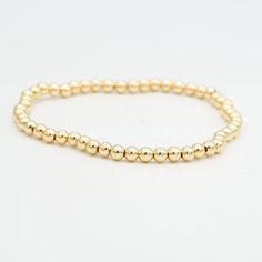 Our royal charm stretch bracelet is just dripping with sophistication. Each 4mm brass bead is plated in real 18K gold. Approximate Inner Diameter: 2-1/4 inches Classic Gold Stretch Bracelet With 8mm Beads, Classic Gold Hypoallergenic Beaded Bracelets, Classic Gold Beaded Jubilee Bracelet, Classic Gold Jubilee Beaded Bracelets, Classic Gold Beaded Bracelets With Round Beads, Elegant Gold Charm Bracelet With Spacer Beads, Elegant Gold Stretch Bracelet With Polished Beads, Classic Yellow Gold Bracelet With 8mm Beads, Elegant Gold Hypoallergenic Rosary Bracelet