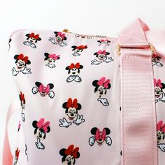 A Duffle for all occasions, for whatever you’re feeling, for wherever the journey takes you. Our Disney’s Minnie Mouse Expression Duffle features a shoulder strap, 2 top handles, a front pocket, a top zipper and an all-over print design showcasing Minnie Mouse with a variety of different facial expressions on a beautiful pink background. Printed Design Adjustable Shoulder Strap Two Top Handles Zip Style Opening Polyester 8.5" depth x 21" width x 14" height ©Disney Licensed Product Disney Shoulder Bag For School With Adjustable Strap, Minnie Mouse Backpack For Travel, Pink Bags With Zipper For Disney Trips, Pink Bags With Zipper Closure For Disney Trips, Cute Minnie Mouse Travel Bag, Disney Style Travel Shoulder Satchel Bag, Disney Shoulder Bag With Adjustable Strap For Travel, Different Facial Expressions, Ereader Case