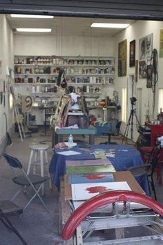 an art studio with tables and chairs in it