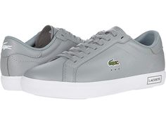 Lacoste Powercourt 0520 1 SFA - Women's Shoes : Grey/White : The Lacoste Powercourt 0520 1 SFA offers style and comfort with a low-profile construction, plain round toe, and color-block accents. Leather and synthetic upper materials. Lace-up design for a secure fit. Signature logo accents at the tongue, side, and heel. Breathable man-made lining. OrthoLite cushioned footbed for all-day comfort. Man-made outsole. Imported. Measurements: Weight: 14 oz Product measurements were taken using size 9, Gray Leather Athleisure Sneakers, Casual Sports Sneakers With Logo, Sports Sneakers With Logo In Synthetic Material, Sports Sneakers With Logo Detail In Synthetic, Synthetic Sneakers With Logo For Sports, Synthetic Sneakers With Logo Detail For Sports, Sports Sneakers With Embossed Logo In Synthetic Material, Synthetic Logo Sneakers For Sports, Sports Sneakers With Embossed Logo In Synthetic