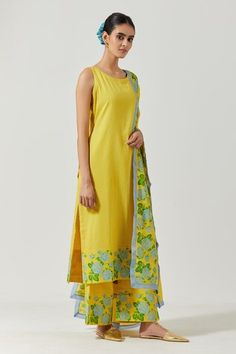 Yellow cotton mul round neck kurta with floral print detailing on hemline. Comes with palazzo and dupatta.
Component: 3
Pattern: Printed
Type Of Work: Floral
Neckline: Round
Sleeve Type: Sleeveless
Fabric: Cotton Mul
Color: Yellow
Other Details: 
Floral print details
Round neckline
Occasion: Mehendi and Haldi - Aza Fashions Sleeveless Cotton Palazzo Set For Summer, Sleeveless Cotton Sets With Printed Motifs, Fitted Sleeveless Cotton Palazzo Set, Sleeveless Cotton Kurta With Floral Embroidery, Traditional Sleeveless Cotton Palazzo Set, Festive Sleeveless Cotton Palazzo Set, Kurta Set For Women, Types Of Work, Kurta Set