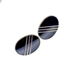 This is a pair of big, natural, black onyx earrings in solid 14K yellow gold. The design of the earrings is iconic to the late 1980s / early 1990s with three slanted 14K gold stripes across a shimmering black onyx face. I can picture Murphy Brown wearing them on air.  They are high quality with thick gold frames and fully welded back bars (none of the wiggle you see in cheap imitations). They are stand-out, attention getting earrings at over an inch in length. Marked 14K on the posts. Very nice condition.  The earrings will ship with a black matte gift box, our custom khaki-cotton gift pouch and a short info sheet describing and guaranteeing them (100% ready for gifting). Murphy Brown, Black Onyx Earrings, Gold Frames, Cotton Gift, Disc Earrings, Onyx Earrings, Cotton Gifts, On Air, Gift Pouch