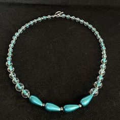 VTG Blue Teal Glass Bead Necklace Silver Tone Clear One Strand Toggle Choker Bib | eBay Turquoise Beaded Glass Jewelry, Turquoise Glass Beaded Necklaces For Jewelry Making, Turquoise Single Strand Glass Jewelry, Elegant Blue Beaded Necklace With Lobster Clasp, Elegant Turquoise Glass Beaded Necklace, Turquoise Glass Single Strand Beaded Necklace, Turquoise Glass Necklaces For Party, Turquoise Glass Necklace For Party, Turquoise Glass Party Necklace