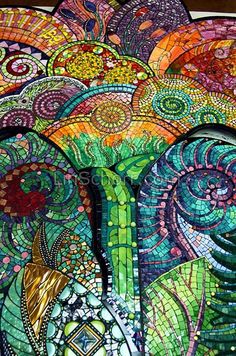 an elephant made out of stained glass is shown