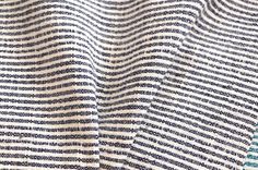 a close up view of a blue and white striped fabric