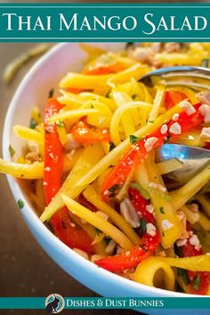 the cover of thai mango salad is shown with a spoon in it's bowl