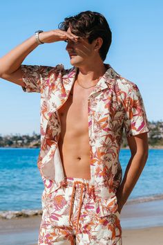 Elevate your summer style with our Coral Flower Tropical Button-Up Shirt for men. The vibrant print exudes tropical vibes, making it an ideal choice for both casual and beach-ready looks. Product code: CBA12A4A002DK Features:  Woven  Collared neckline  Short sleeves  Front buttons  Regular fit Pattern: Tropical Wash Method: Hand Wash Material: 100%POLYESTER. Multicolor Hawaiian Camp Shirt For Beach, Hawaiian Multicolor Camp Shirt For Beach, Multicolor Hawaiian Shirt For Beach, Hawaiian Printed Camp Shirt For Beach Season, Multicolor Hibiscus Print Camp Shirt For Beach, Multicolor Palm Tree Print Camp Shirt For Beach Season, Summer Beach Shirt With Short Sleeves, Short Sleeve Beach Shirt For Summer, Short Sleeve Summer Beach Shirt