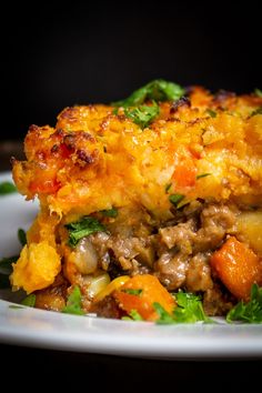 a close up of a plate of food with meat and vegetables