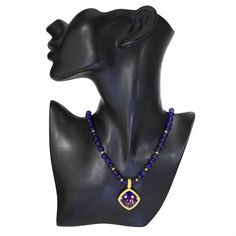 The Royal Collection is inspired by an intricate mosaic of royal palaces around the world. From exotic Marrakesh and colorful Barcelona, to the magical islands of Greece, it reminds us that we’re all descendants of kings. Handmade in NYC. Limited Edition. Price includes 18-inch (457.2 mm) strand of round amethyst beads. Enhancer dimensions: 41 mm L by 29 mm W. For additional wearability and pricing options, please contact us. Metal: 18 karat yellow gold. Center Amethyst: 1 stone, total carat wei Luxury Amethyst Pendant Jewelry, Luxury Tanzanite Jewelry With Gemstone Accents, Luxury Purple Pendant Necklace, Luxury Amethyst Pendant Necklace, Luxury Yellow Gold Amethyst Necklace, Elegant Gold Amethyst Necklace, Elegant Purple Gold-plated Jewelry, Luxury Purple Necklace With Gemstone Beads, Luxury Amethyst Necklace With Gemstone Accents