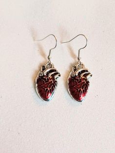 Anatomical heart dangling earrings with hypoallergenic and nickel free backs of your choice Hypoallergenic Drop Earrings For Valentine's Day, Red Hypoallergenic Metal Jewelry, Hypoallergenic Red Metal Jewelry, Red Nickel-free Dangle Heart Earrings, Gift Dangle Earrings, Hypoallergenic Metal Earrings For Valentine's Day, Heart-shaped Surgical Steel Jewelry For Gifts, Heart-shaped Internally Threaded Earrings As Gift, Hypoallergenic Surgical Steel Earrings