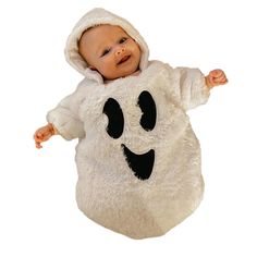 a baby dressed in a ghost costume