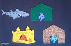 some paper cut out animals and fish on a blue background