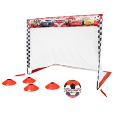 a soccer ball sitting next to some cones and tees with cars on them in front of a white background