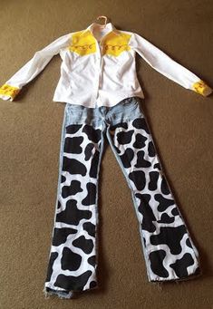 a child's cow print pants and white shirt