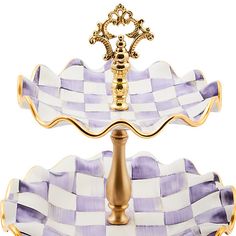 two tiered trays with gold accents and purple checkerboard design on them