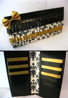 an open black and white purse with gold ribbon on the front, inside and outside