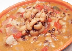 a close up of a bowl of food with beans