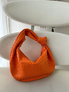 GIFT WRAPPING AVAILABLE: simply mark your order as a "gift" Introducing our stylish dumpling bag with woven knot detail, perfect for the modern woman on-the-go! This hobo shoulder braid bag in trendy orange color is not only a fashion statement but also a functional accessory. With its unique design and high-quality craftsmanship, this best seller is sure to impress. Treat yourself or surprise your girlfriend with this must-have gift that will elevate any outfit effortlessly. Order yours today a Trendy Satchel Baguette Bag As Gift, Trendy Handheld Baguette Bag Gift, Baguette Bag With Removable Pouch As Gift, Trendy Tote Baguette Bag As Gift, Trendy Baguette Shoulder Bag For Gift, Trendy Baguette Shoulder Bag As A Gift, Trendy Single Handle Shoulder Bag As Gift, Trendy Pouch Baguette Bag As Gift, Trendy Baguette Bag For Gift