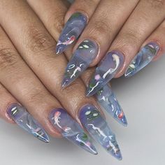 🌸💧 Tranquil Koi Pond Press-On Nail Set | Elegant Almond Nails with 3D Koi and Floral Art 🐟🌿 Dive into serenity with our Tranquil Koi Pond Press-On Nail Set, where each nail is a masterpiece of calm and elegance. Featuring hand-painted koi fish and delicate floral sculptures, this set brings the beauty of a peaceful garden pond to your fingertips. 🐟🌸 Key Features & Highlights: Soft Pastel Palette: Embrace the soothing shades of peach and soft white, designed to replicate the tranquil waters of a koi pond. Perfect for a fresh, serene look. 🎨🌤️ Intricate 3D Artwork: Hand-Painted Koi Fish: Each nail features a beautifully detailed koi fish, symbolizing good fortune and perseverance, swimming across a serene backdrop. 🐟🖌️ Sculpted Floral Details: Delicate 3D flowers in bloom add a tou Koi Nails, Clear Press On Nails, Fish Nail Art, Fish Nails, Lovely Nails, Nails Today, Shades Of Peach, Nails At Home, Nails Inspo