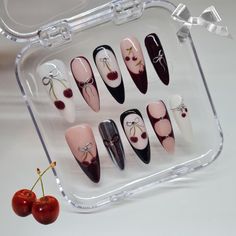 Hand painted 'Black cherry' press on nail set The nails pictured are in the style long stiletto. As the nails are fully hand painted they can vary slightly but i will try my best to get them as accurate to the picture as i can, but no matter what they'll always look amazing!! All my press ons are sent in super cute packaging (of course)! The standard packaging is a recyclable nail card (seen in picture 3) that will hold your new set of nails, the option of a reusable compact (seen in picture 1) Black And Cherry Nails, Cherry Nails Acrylic Black, Black French With Cherries Nails, Black Nails With Cherries, Black Cherry Gel Nails, Cherry Press On Nails, Cherries Aesthetic, Nails 2016, Nails Y2k