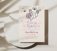 a ghost birthday party card on top of a plate