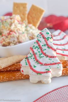 some crackers are decorated with christmas trees and sprinkles