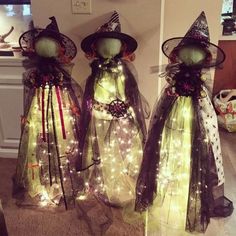 two halloween costumes with lights on them