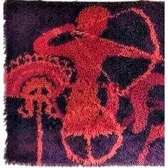 a red and black rug with an image of a person on it