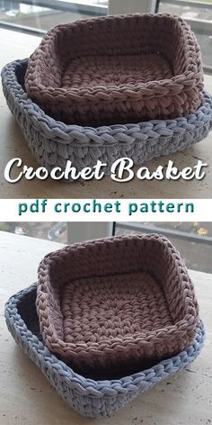 two crocheted baskets sitting on top of a table