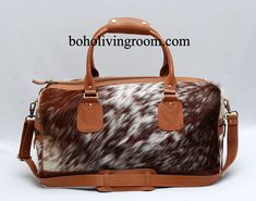 Looking for a stylish and functional travel bag? Look no further than this cowhide speckled brown and white bag. Perfect for your next trip! *Free shipping *The size of this cowhide travel bag is approx 20" long x 9.5" high x 10.5" wide (approx) *Detachable Shoulder Strap 116cm long. Handle drop (from the middle) = 20cm * All western weekender bags are lined and have zipper pockets inside. * Top quality cowhide leather. * Double Stitched Seams. * Thick Stitching. * Reinforced Handles. *Each cowh Rectangular Calf Hair Travel Bag, White Leather Travel Bag, White Leather Weekender Bag, White Leather Weekender Bag With Luggage Sleeve, Luxury White Leather Travel Bag, White Leather Rectangular Weekender Bag, Brown Cow Print Bag For Everyday Use, Leather And Cowhide Purses, Cowhide Duffle Bag