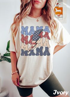 Get ready to rock that casual chic look with our Retro Mama Fourth of July T-shirt ❤️ Get retro with this mama tee! Featuring lightning bolt and USA flag, this design is perfect for all the patriotic/new moms out there. Show off your retro style and spread a positive vibe with this graphic t-shirt. ❤️ Size up, babe! Go 1-2 sizes bigger for that oversized stunner. Elevate your style, own the spotlight, and unleash your fashion power. It's time to rock the room with your effortlessly chic vibe. Ge Momma Shirts, Freedom Shirts, Fourth Of July Shirts, Mama T Shirt, 4th Of July Shirt, Mama Shirts, American Flag Shirt, Graphic Tee Design, Vintage Usa