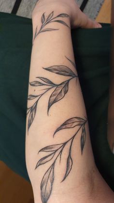 a person with a tattoo on their arm