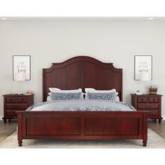 a large bed sitting in a bedroom next to two nightstands