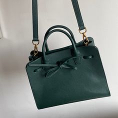 Mansur Gavriel, Excellent Condition Bow And Adjustable Straps Elegant Green Shoulder Bag With Large Capacity, Elegant Large Capacity Green Shoulder Bag, Classic Green Satchel For Shopping, Classic Green Handheld Bag, Elegant Green Box Bag With Large Capacity, Green Large Capacity Bags For Formal Occasions, Green Leather Handheld Box Bag, Classic Green Bag For Daily Use, Chic Green Bags For Daily Use