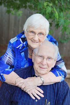 an older woman is holding the arm of her younger lady