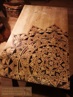 a wooden table with an intricate design on it